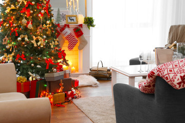 Cozy Christmas interior of living room with beautiful fir tree