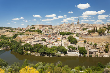 Fototapeta na wymiar Toledo in the summer by the river Tajo 