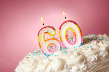 Birthday cake with candles on color background