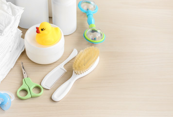 Set of baby accessories for hygiene on wooden table closeup