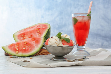Ice-cream with watermelon and cocktail on light background