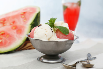 Ice-cream with watermelon and cocktail on light background