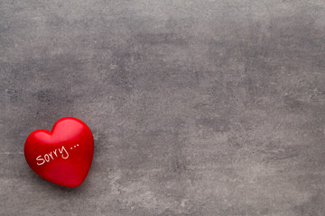 Valentine day  Red heart on the dark boards.