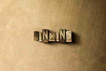 Obraz premium LINKING - close-up of grungy vintage typeset word on metal backdrop. Royalty free stock - 3D rendered stock image. Can be used for online banner ads and direct mail.