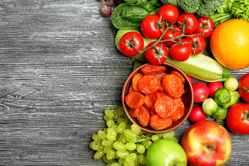 Fruits and vegetables on wooden background