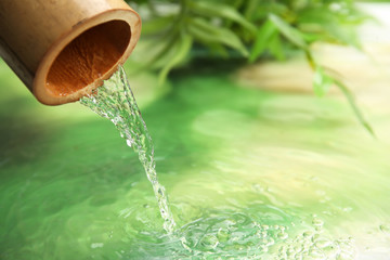 Beautiful spa composition with pouring water
