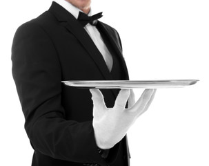 Young waiter with tray on white background