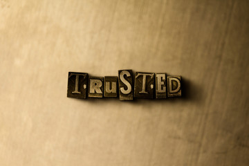 TRUSTED - close-up of grungy vintage typeset word on metal backdrop. Royalty free stock - 3D rendered stock image.  Can be used for online banner ads and direct mail.