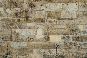 Old corroded running bond stone wall background