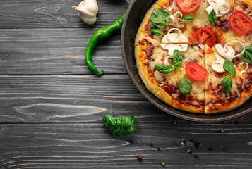 Freshly baked pizza in a pan