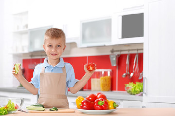 Little boy cooking in the kitchen