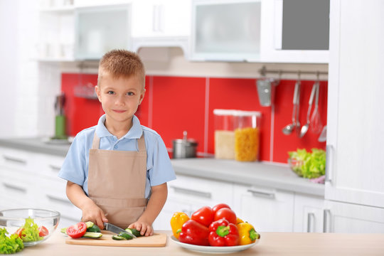 Little boy cooking in the kitchen