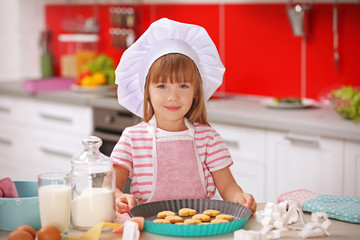 Little girl cooking in the kitchen