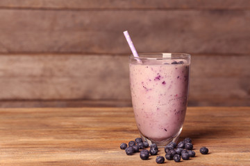 Blueberry milkshake on wooden table