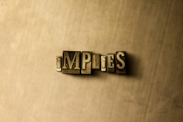 IMPLIES - close-up of grungy vintage typeset word on metal backdrop. Royalty free stock - 3D rendered stock image.  Can be used for online banner ads and direct mail.