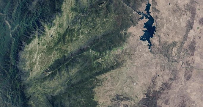 High-altitude overflight aerial of the Snowy Mountains, New South Wales, Australia. Clip loops and is reversible. Elements of this image furnished by USGS/NASA Landsat