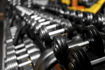 Fototapeta premium Closeup of dumbbells in gym