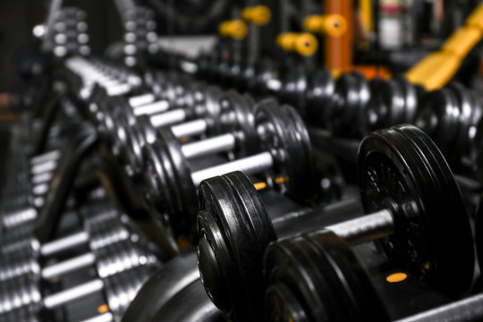 Closeup of dumbbells in gym