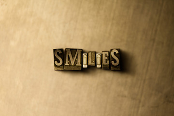 SMILIES - close-up of grungy vintage typeset word on metal backdrop. Royalty free stock - 3D rendered stock image.  Can be used for online banner ads and direct mail.