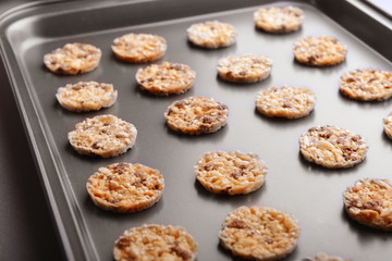 Cereal cookies on baking tray, closeup
