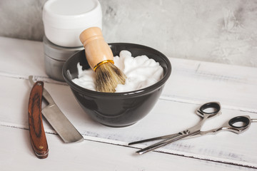 Wooden desktop with tools for shaving beards