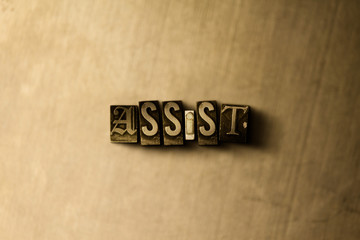 ASSIST - close-up of grungy vintage typeset word on metal backdrop. Royalty free stock - 3D rendered stock image.  Can be used for online banner ads and direct mail.