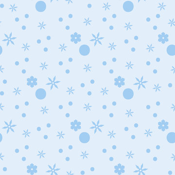 Seamless simple pattern with small circles and stars. Winter background. Substrate in the blue range. Small chaotic light blue pattern of snowflakes.