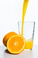 Glass of Orange Juice and Orange Slices Isolated on White