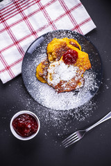 Pumpkin pancake with redcurrant marmalade and sugar