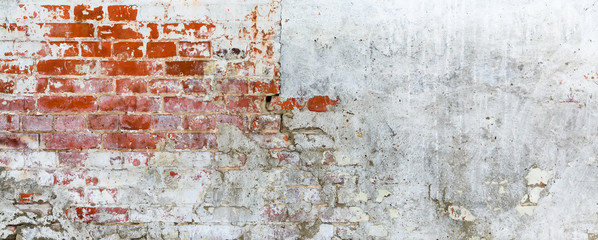 Vintage brick rough rustic wall with cracked plaster
