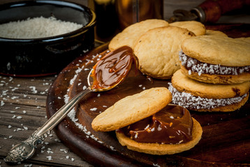 Cooking alfajores - a traditional dessert from Latin America or Mexico. Shortbread cookies with...