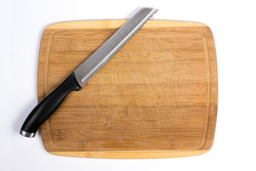 Wooden Cutting Board with Bread Knife Isolated on White