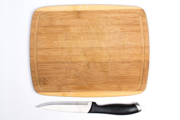 Wooden Cutting Board with Small Knife Beside Isolated on White