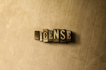 LICENSE - close-up of grungy vintage typeset word on metal backdrop. Royalty free stock - 3D rendered stock image.  Can be used for online banner ads and direct mail.