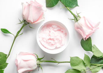 Obraz na płótnie Canvas organic cream with rose oil on white background top view