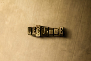 LECTURE - close-up of grungy vintage typeset word on metal backdrop. Royalty free stock - 3D rendered stock image.  Can be used for online banner ads and direct mail.