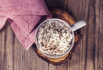 A cup of hot cocoa on a wooden table