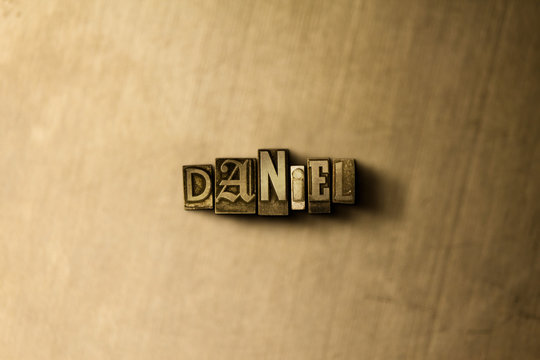 DANIEL - close-up of grungy vintage typeset word on metal backdrop. Royalty free stock - 3D rendered stock image.  Can be used for online banner ads and direct mail.