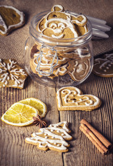 Gingerbread cookies in a jar on a wooden table