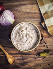 Homemade tasty lard with onion greaves and pickles, top view