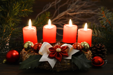 Christmas Advent wreath with four burning candles  