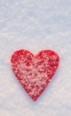 Red felt heart on snow, Valentine's Day. Copy space for text. Snowflakes on heart. Valentines day, love concept. White background