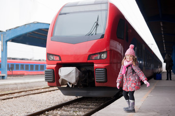 Girl at the railway station waiting for the train