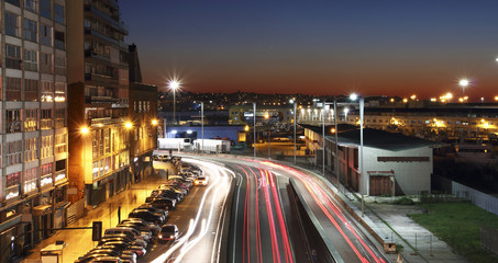 Fototapeta na wymiar Vigo city at sunset with the lights of cars in motion