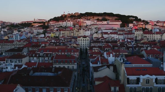 Portugal, Lisbon, Miradouro de Santa Justa, View over downtown and Santa Justa Street towards the castle hill at sunset.
