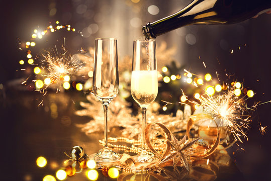 Christmas and celebration with champagne. New Year holiday decorated table