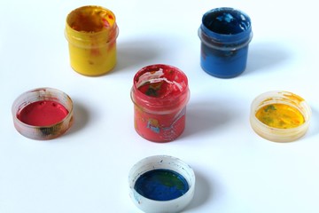 The paint gouache stand on the table.