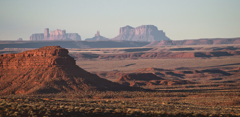 Scenic view of the monument valley from the Valley of Gods, in a foggy mornig, with desert...