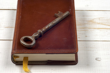 old keys on book, antique wood background
