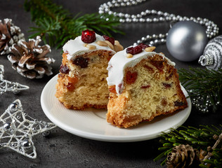 two pieces of christmas cake with fruits and nuts